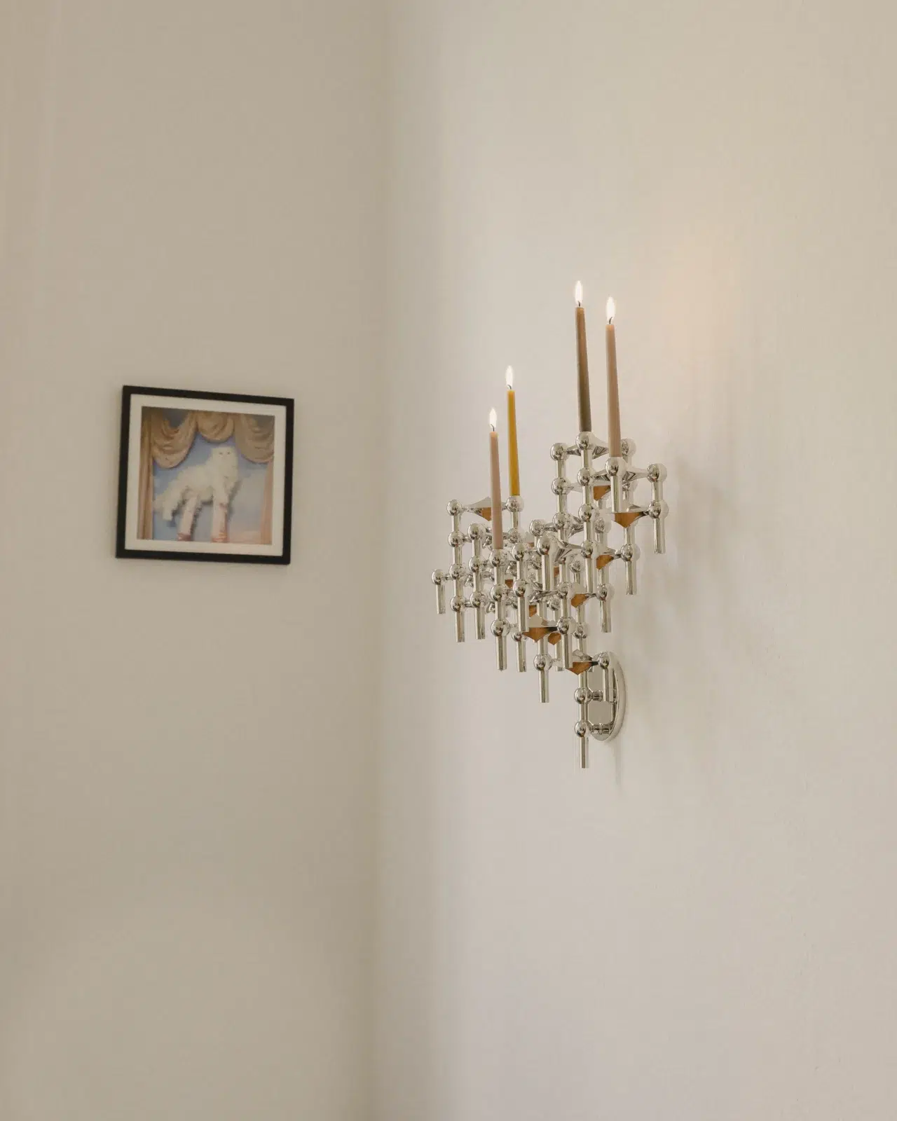 Linda Käckermann for STOFF Nagel. The STOFF Nagel wall hanger and Nagel candle holders in chrome.