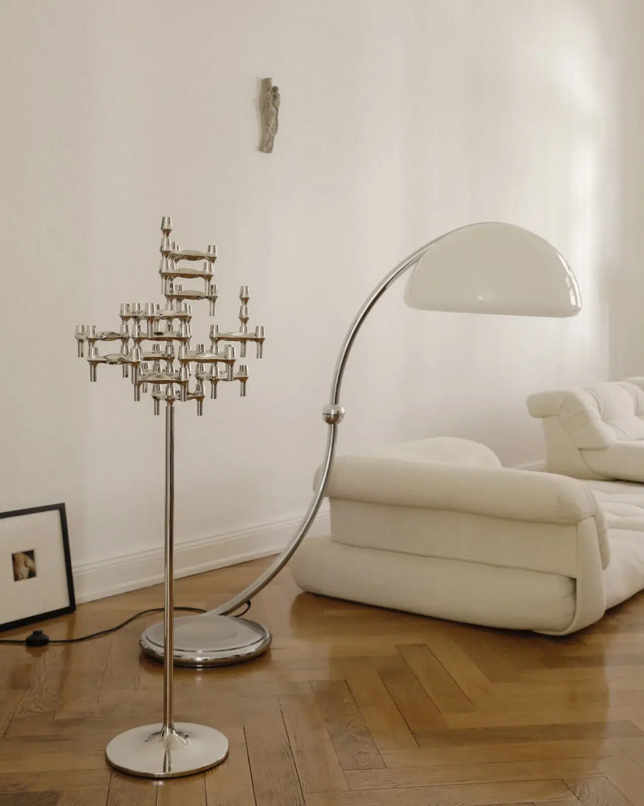 Linda Käckermann for STOFF Nagel at home showing the STOFF Nagel floor stand with the BMF candle holders and vases in chrome.