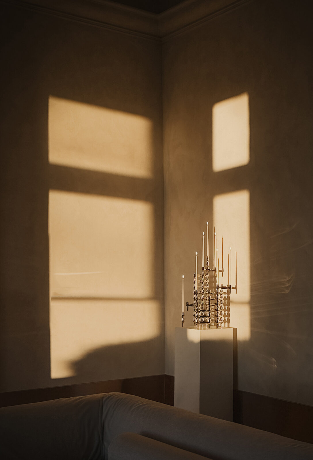 stoff nagel: a candle holder sculpture made of BMF candle holders in chrome